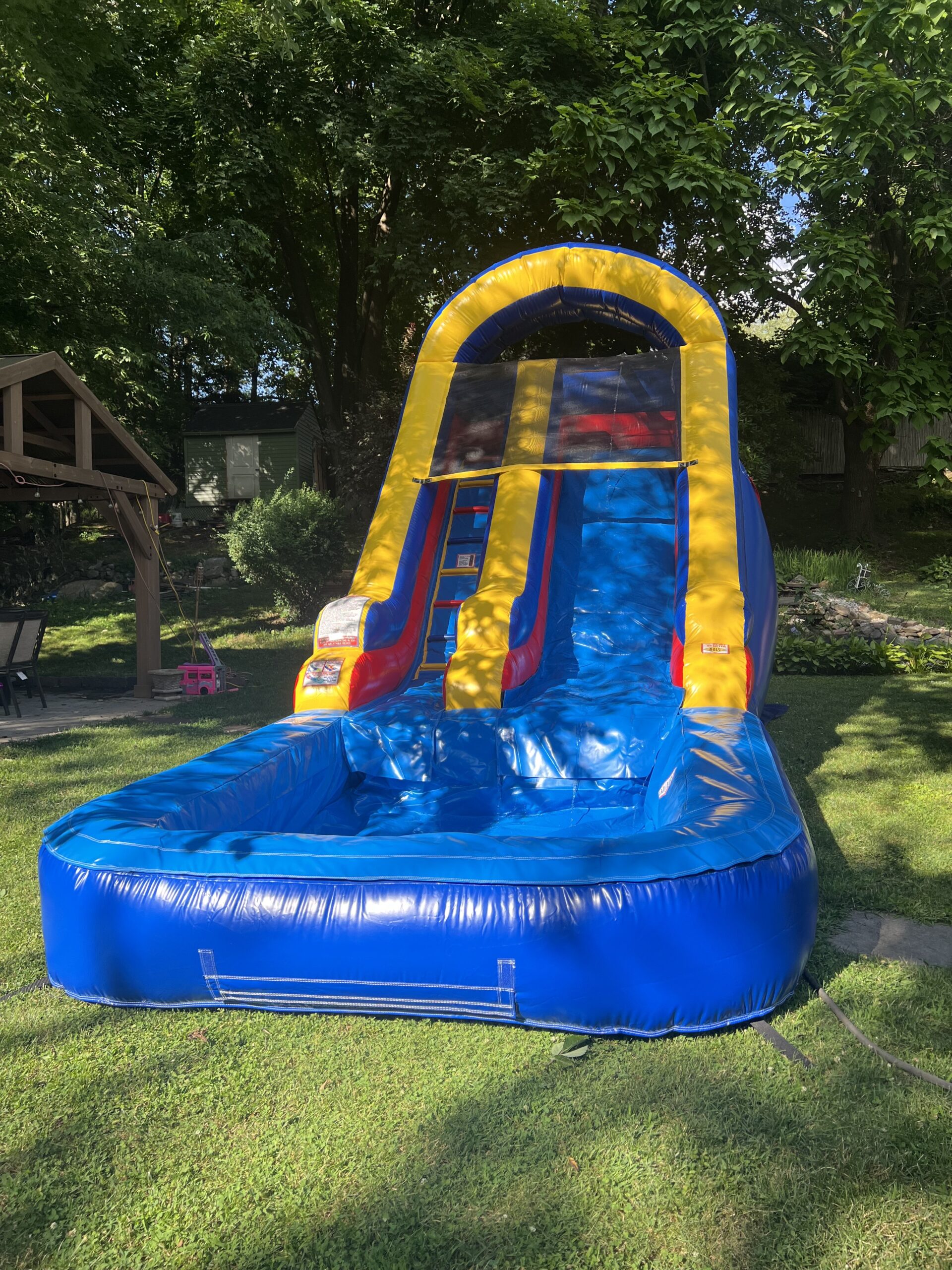 Multi-Color Arch Bounce House rental in Connecticut for parties and events.